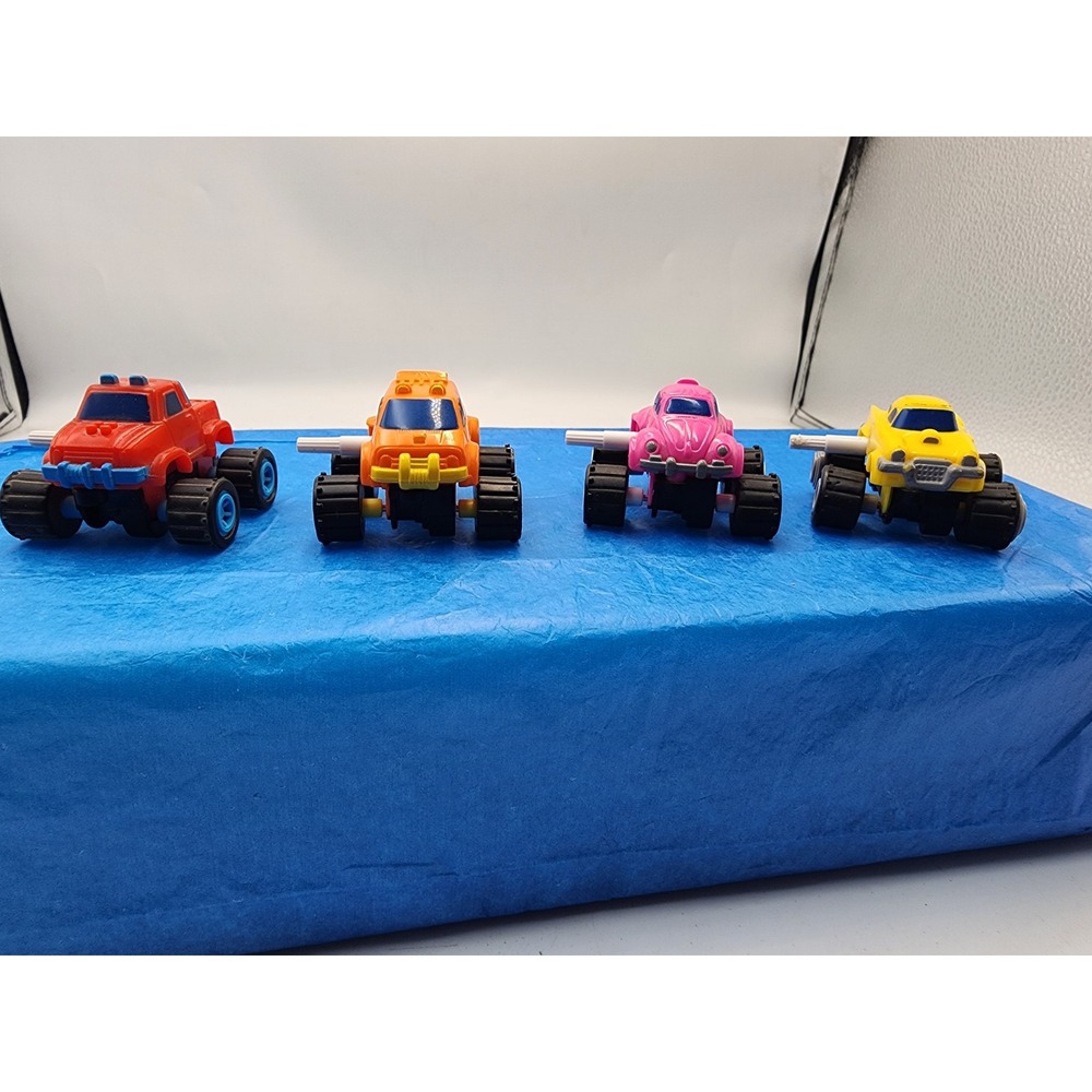 Vintage Style Wind Up Monster Truck Toy Car Lot Red Orange Pink Yellow Set of 4